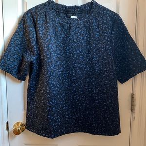 NWT Animal print top with short sleeves and ruffle neck